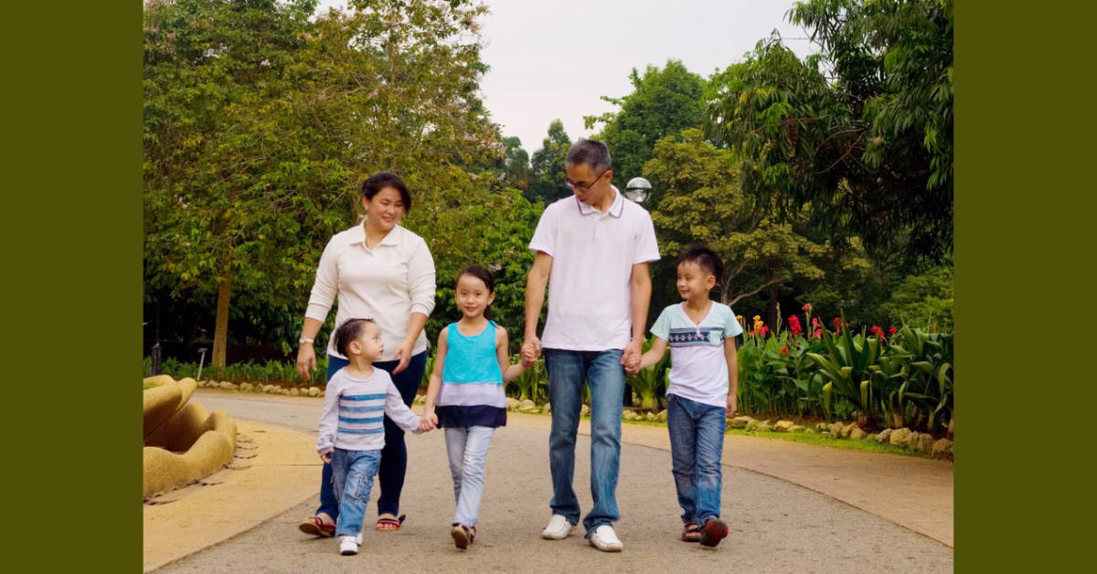 asian family is walking in a garden